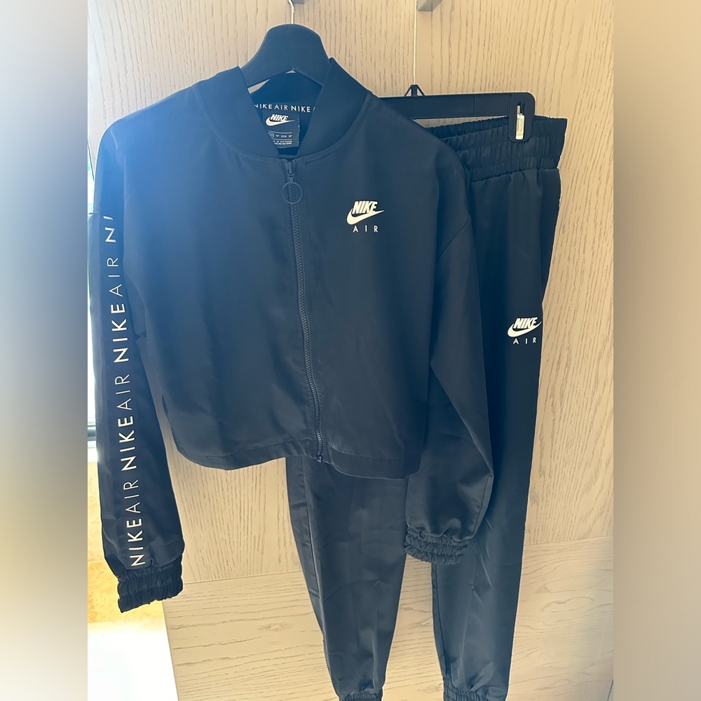 Nike black polyester track suit. Jacket size xs pants size small